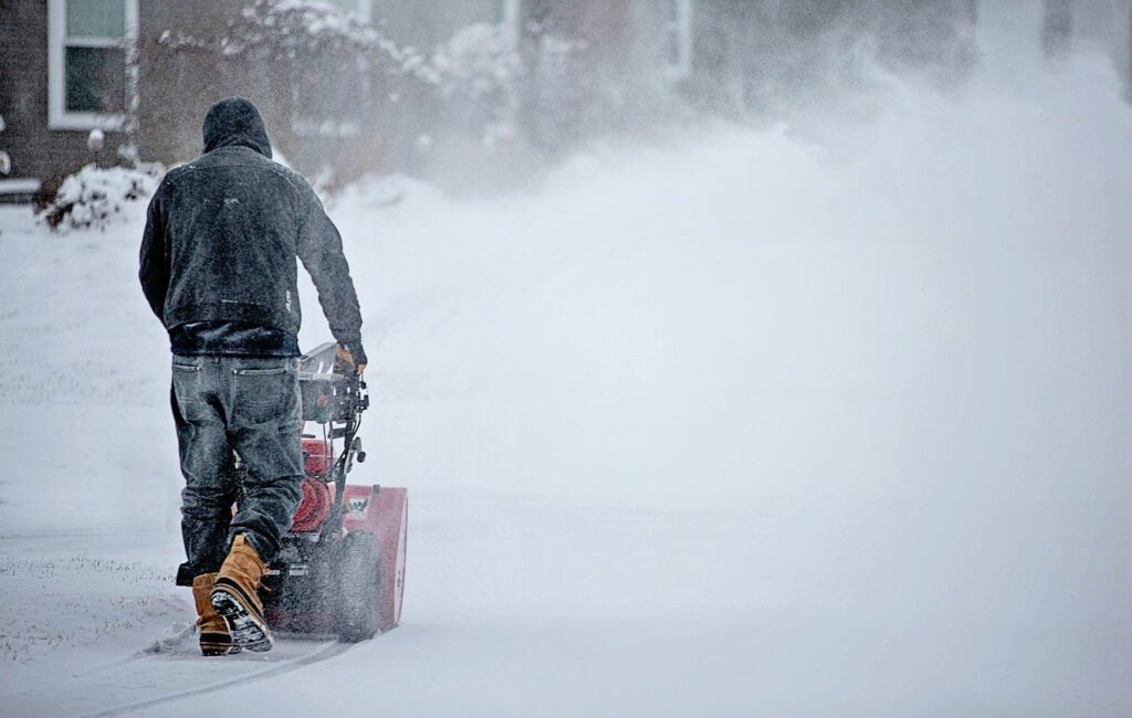 Snow blowing driveway